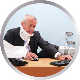 Injured man working on computer